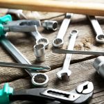 Working tools on a grey wooden table