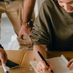 couple reviewing moving checklist together