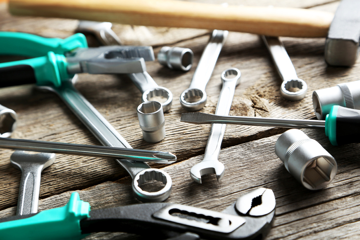 Working tools on a grey wooden table