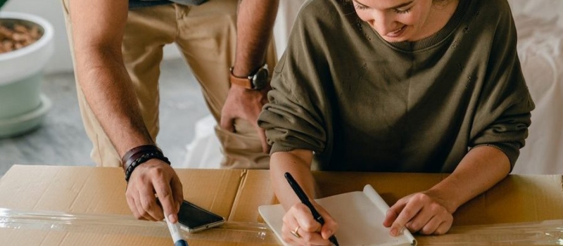 couple reviewing moving checklist together